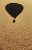 Shadow from an air-balloon on the ground. Namib Naukluft National Park. Namibia