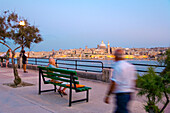 People at the promenade in the evening, view at Valletta, Sliema, Malta, Europe