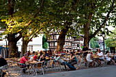 People sitting in a cafe, Petite France, Strasbourg, Alsace, France