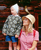 Mother and daughter in front of an alp lodge, Eng, Kleiner Ahornboden, Tyrol, Austria