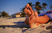 Woman feet on the beach