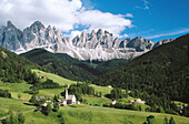 Village of Santa Magdalena in in the Odles Mountains (Val di Funes). Dolomites at the background. Alps. Italy