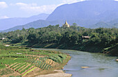 Nam Khan River and Wat Phone Phao in background. Luang Prabang. Laos