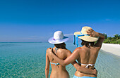 Women on the beach in Ari Atoll. Maldives