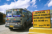 Bus in he road from Leh to Nubra Valley (the highest motorable road in the world with 5,603 meters high in 39 kilometres). Jammu and Kashmir. India
