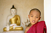 Novice monk in Buddhist pagoda. Mandalay. Myanmar (Burma).