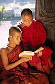 Monks in wood monastery. Inle Lake. Shan State. Myanmar.