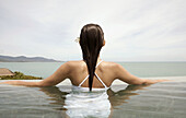 Koh Samui Island. Thai woman in swimming pool. Thailand.