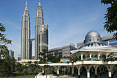 Malaysia. Kuala Lumpur. Petronas Towers and Al-Asykin Mosque.