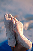 Woman s feet on beach