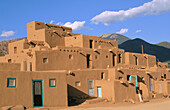 Evening light on the 3-story adobe North House (World Heritage Site), Taos Pueblo, New Mexico, USA