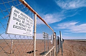 Gate along dingo fence, which is 5614 km in length, longest fence in world. Australia