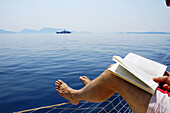 Reading aboard a yacht i Greece