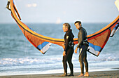 Kite surfers or kite sailors.