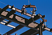Ironworkers hang steel beams, construction. Boston. Massachusetts. USA