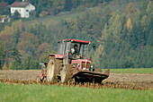 Tractor ploughing a field. Lower Bavaria. Germany.