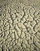 Dry mud with intricate pattern of cracks in Panamint dry lake. Death Valley NP. California. USA