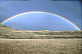 Rainbow. Castle Hill Basin. Canterbury. New Zealand.
