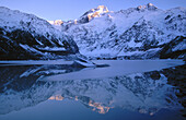 Winter dawn. Mount Sefton. Reflection in Mueller Glacier Lake. Mount Cook National Park. New Zealand.