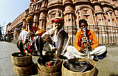 Snake charmers in front of the Hawa Mahal. Jaipur. Rajasthan, India.