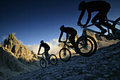 Mountain bikers on mountain path, Tre Cime di Lavaredo, Dolomites, Veneto, Italy