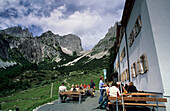 hikers on terrace of hut Gaudeamushuette, Gaudeamus-Huette, Wilder Kaiser range, Kaisergebirge range, Tyrol, Austria