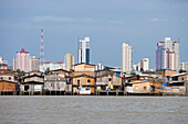 Sharp contrast of stilt houses and City high-rise buildings, Belem, Para, Brazil, South America