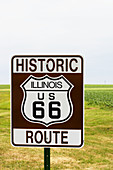 Historic Illinois US Route 66 sign, farm fields in distance. Odell. Illinois, USA