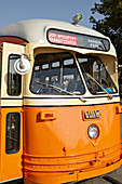 USA, Wisconsin, Kenosha. Restored orange streetcar, front of vehicle, route name