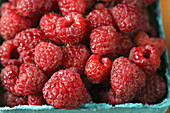 Fruit. Riverwoods, Illinois. Pint box of ripe red raspberries