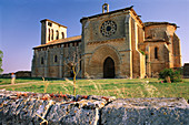 Church of Santa María de los Reyes from the stone wall which surrounds it. Grijalba. Burgos province, Spain
