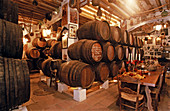 Northern Red Oak wooden barrels in wine cellar, Anise Museum of Duende distilleries. Rute. Córdoba province, Spain