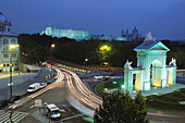 Roundabout, San Vicente town gate with Royal Palace and Almudena cathedral in background. Madrid. Spain