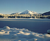 Snow covers Sparks Lake (morning January). Deschutes National Forest. Oregon. USA