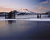 Sunrise on South Sister from Sparks Lake after fall snowstorm. Deschutes National Forest, Deschutes County. Central Oregon. USA.