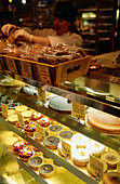 Pastry and cake display at grocery Fox & Obel, Chicago, Illinois, USA