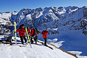 group of backcountry skiers on Summit of Schafkopf, Lechtal range, Tyrol, Austria