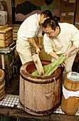 Men making green tea mochi (rice cakes). Nara. Japan