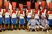 Men relaxing and posing for photographs before taking part in a rikutogyo (procession) during Tenjin Matsuri (traditional Japanese festival). Tenmangu Shrine. Osaka, Japan.