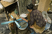 Woman making rice paper. Don Teav, Battambang province, Cambodia.