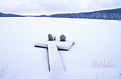 Adirondack chairs in a dock in winter. Poconos. Pennsylvania