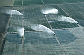 Agribusiness aerial irrigation, encroachment on Everglades. Florida, USA