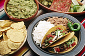 Tostadas, guacamole, salsa and tacos