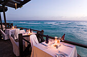 Terrace by the water's edge in the evening of the restaurant Josef's, St. Lawrence Gap, Barbados, Caribbean