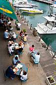 People sitting in a waterfront cafe, Bridgetown, Barbados, Caribbean