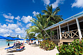 People relaxing at beach, Mullins Bay, Speightstown, Barbados, Caribbean