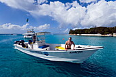 Man in a motorboat, Sandy Lane Bay, Barbados, Caribbean