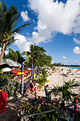 People relaxing at beach near the Boatyard beach bar, Bridgetown, Barbados, Caribbean
