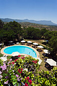 View over swimming pool of Taita Hills Lodge, Taita hills in background, Coast, Kenya