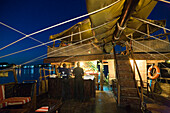 Illuminated ship Dhau of the restaurant Tamarind at night, Mombasa, Kenya